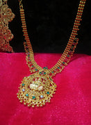 N0191_Elegant Micro Gold plated Necklace with delicate work of lakshmi design pendant studded with a touch of Precious pink & green ruby stones.