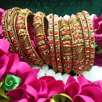 B0167_Gorgeous traditional style Matte finish designer golden bangle set studded with semi precious red & golden stones.