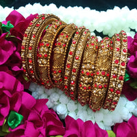 B0167_Gorgeous traditional style Matte finish designer golden bangle set studded with semi precious red & golden stones.