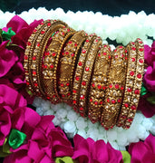 B0167_Gorgeous traditional style Matte finish designer golden bangle set studded with semi precious red & golden stones.