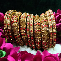 B0167_Gorgeous traditional style Matte finish designer golden bangle set studded with semi precious red & golden stones.