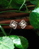 E0600_Elegant Dazzling silver toned studs embellished with shiny stones.