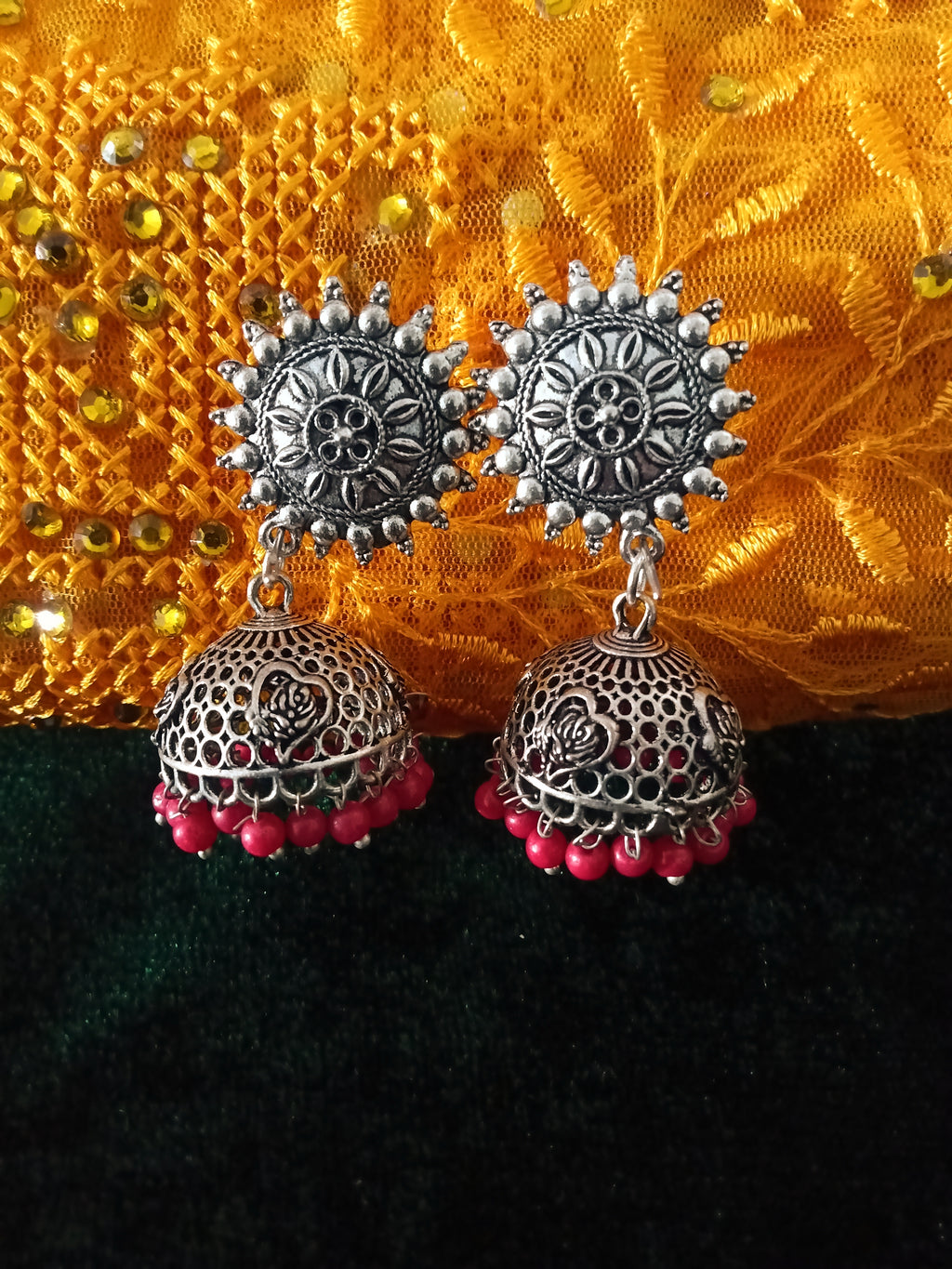 E0612_Beautiful German Silver oxidized crafted flower design jumkas  with a touch of red color bead drops (medium size).