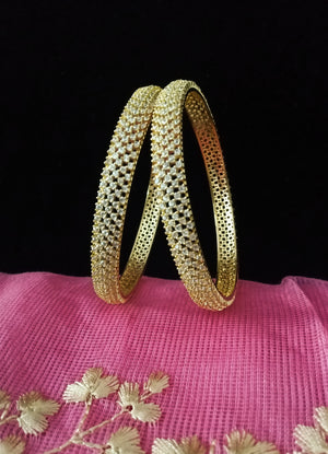 B060_Gorgeous Gold plated bangles studded with  American Diamond stones.