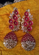 E15_Sparkling red colored earring crafted with elegant Meenakari work and Polki stones.