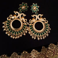 E0643_Lovely circular shaped danglers with peacock work studded with green stones with a touch of pearls.