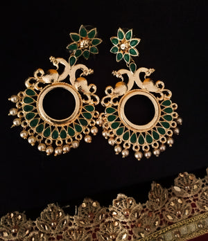 E0643_Lovely circular shaped danglers with peacock work studded with green stones with a touch of pearls.