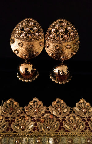 E0141_Glossy Golden Meenakari jumkas studded with stones.