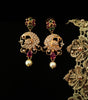 E0667_Beautiful crafted peacock design earrings studded with American diamond stones with a touch of pink & green stones with pearl drops.