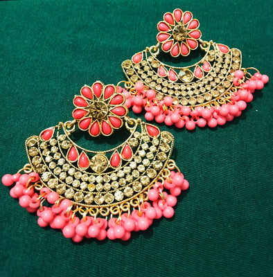 E0692_Dazzling grand stone studded earrings with a delicate stone work with a touch of pink bead drops.