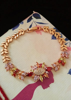 B043_ Gorgeous Rose gold base bracelet studded with multi color semi precious stones.