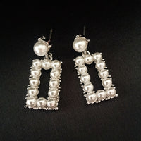 E0704_Trendy rectangular shaped danglers embellished with pearls.