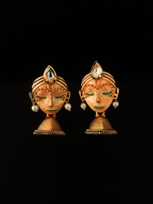 E0714_Classy crafted women face embossed earrings with a touch of pearls and stones along with a jumka drop.