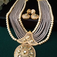 N0130_Gorgeous elaborated grey Crystal layered necklace set studded with kundan stones with a touch of pearls.