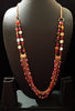 N0265_Lovely crafted multilayered long shimmery necklace with a touch of glossy beads.