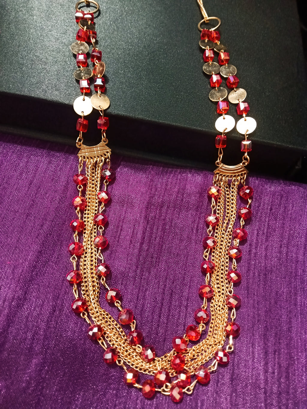 N0265_Lovely crafted multilayered long shimmery necklace with a touch of glossy beads.