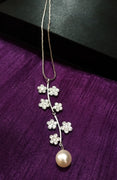 N0267_Elegant trendy long necklace with a touch of sparkling stones with delicate flower  designs.