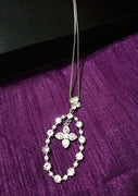 N0269_Elegant trendy long necklace with a touch of sparkling stones oval shaped pendant with flower designs.