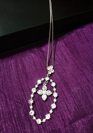 N0269_Elegant trendy long necklace with a touch of sparkling stones oval shaped pendant with flower designs.