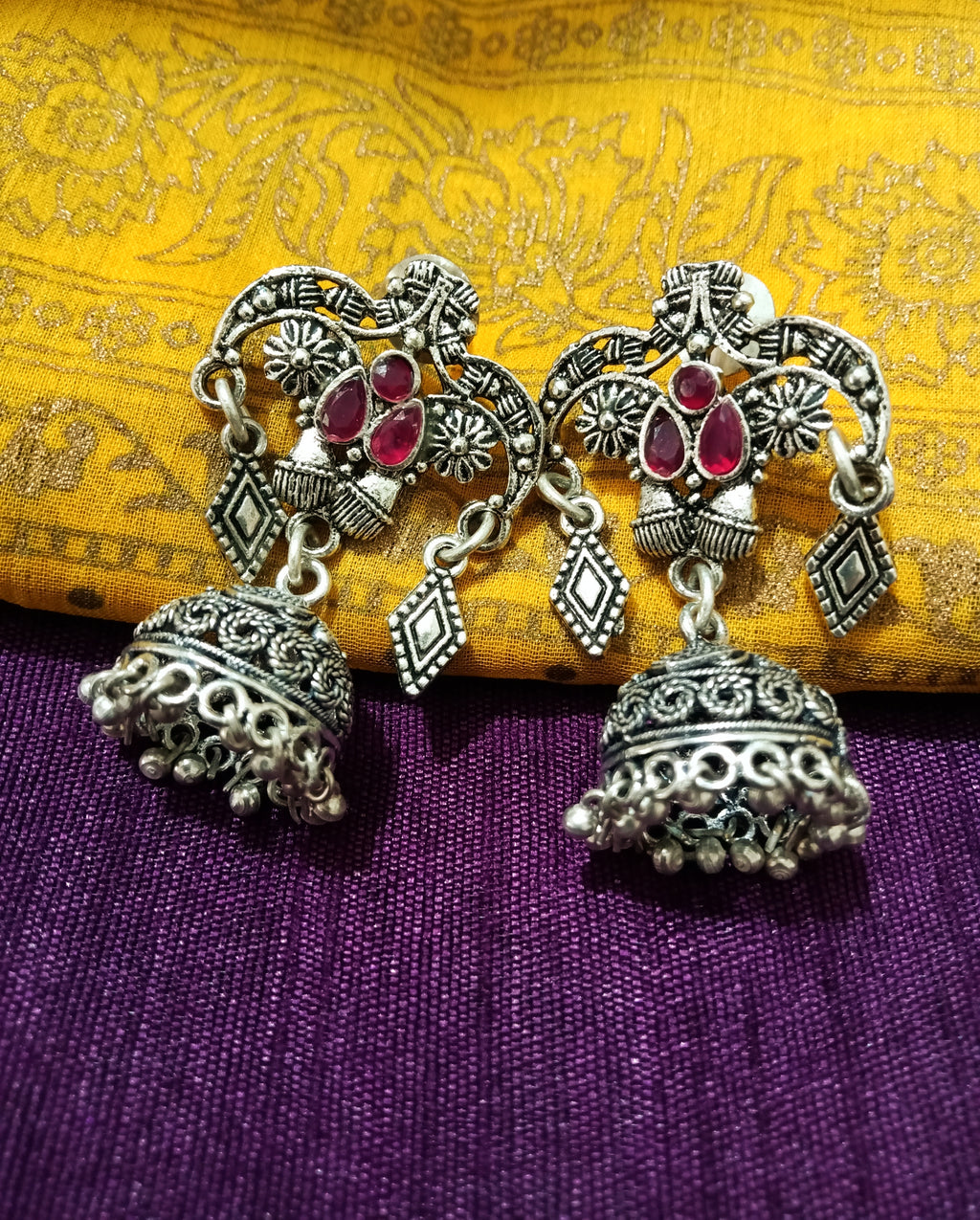 E0764_Gorgeous crafted design German silver oxidized jumkas with bead drops studded with stones.