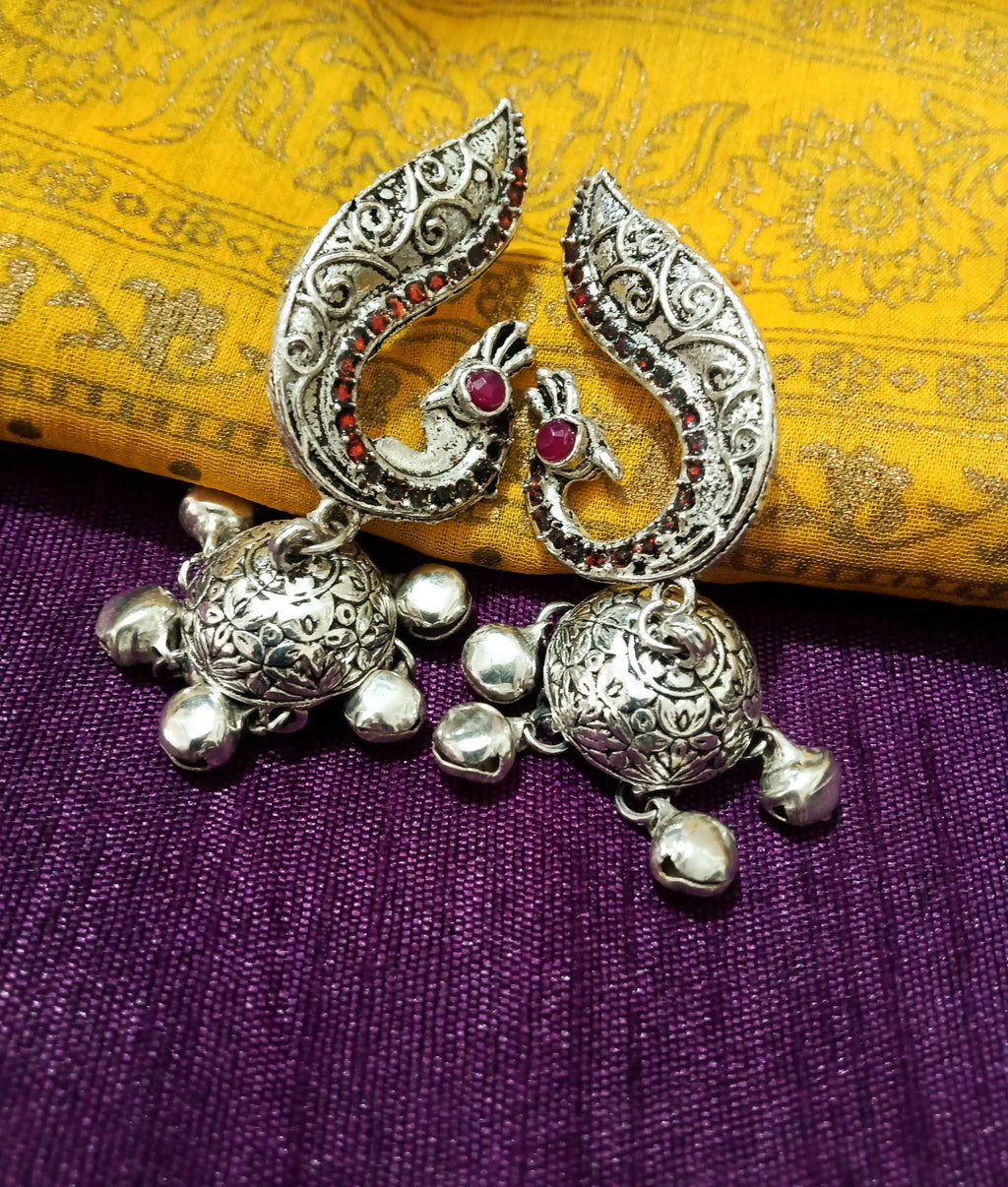 E0770_Lovely crafted German silver oxidized peacock pattern jumkas with a touch of jumka stones along with bead drops.