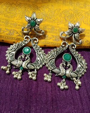 E0772_ Classy crafted peacock pattern German silver oxidized danglers with a touch of stones along with bead drops.