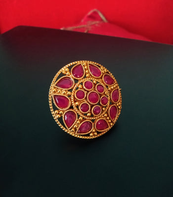 R027_Gorgeous circular shaped golden color rings with a touch of semi precious pink ruby  stones.