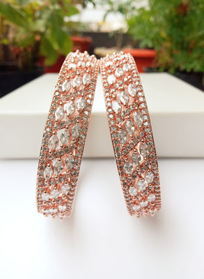 B0157_Elegant design Rose gold bangle studded with American Diamond stones.