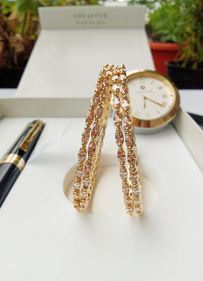 B0164_Elegant Golden sleek bangles studded with a touch of American Diamond stones.