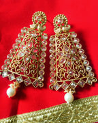 E0795_Grand crafted designer golden color danglers studded with a touch of dazzling american diamond stones with a touch of pearl drops.