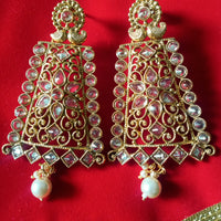 E0795_Grand crafted designer golden color danglers studded with a touch of dazzling american diamond stones with a touch of pearl drops.