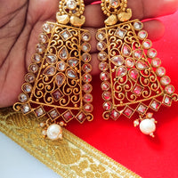 E0795_Grand crafted designer golden color danglers studded with a touch of dazzling american diamond stones with a touch of pearl drops.