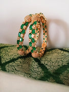 B0176_Gorgeous golden bangles embellished with American Diamond stones with a touch of green stones.