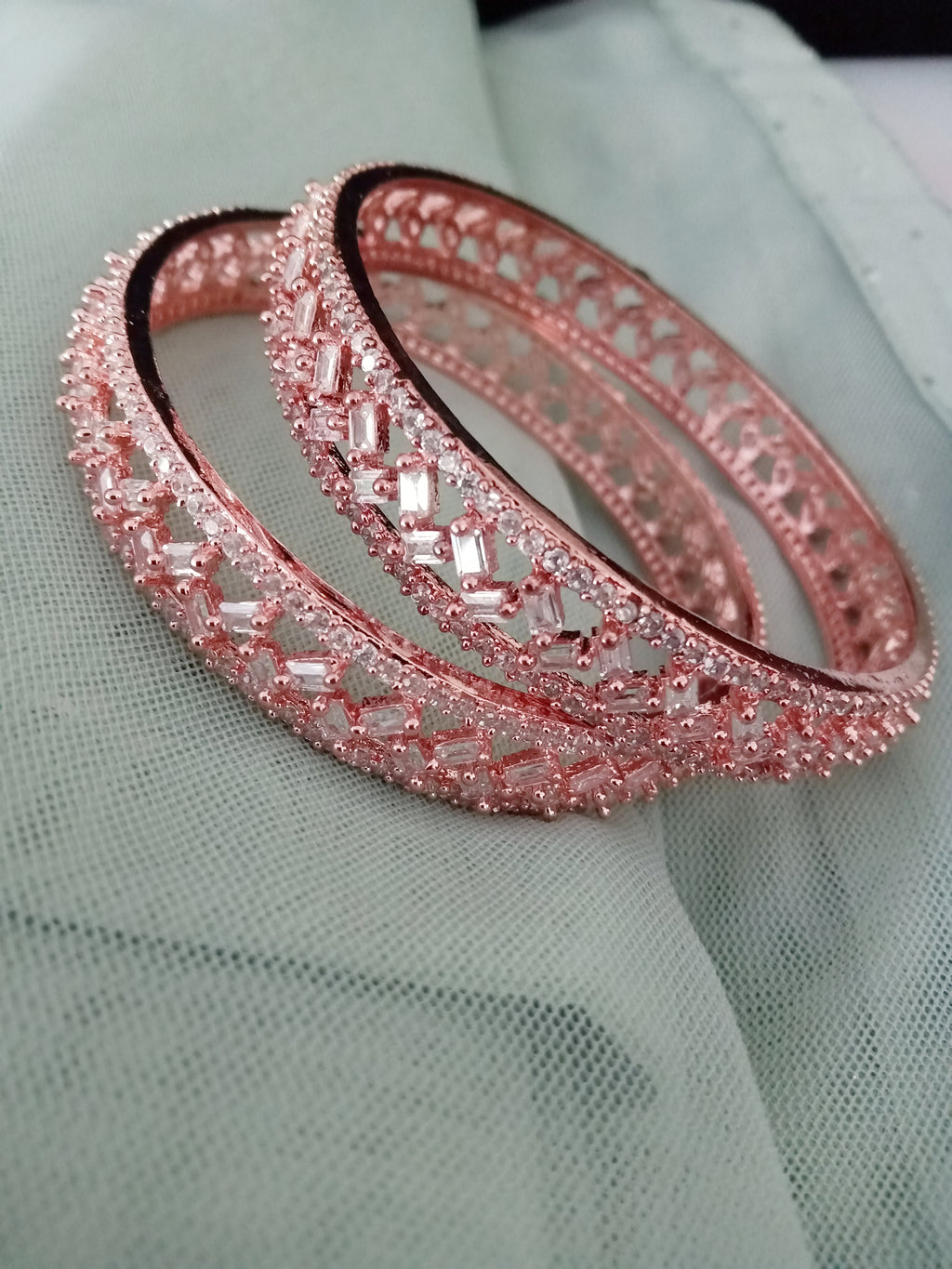 B0199_Lovely fine rose gold bangles embellished with American Diamond stones with delicate stone work.