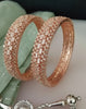 B0200_Grand broad design rose gold bangles studded with American Diamond stones with delicate stone work.