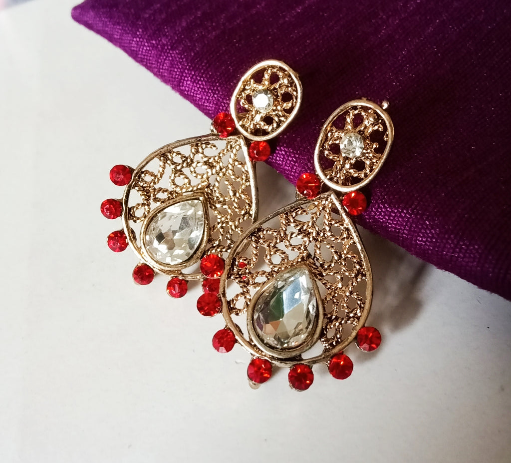 E0829_Beautiful crafted golden color ear drop hanging studded with red stones.