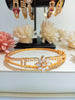 B0204_Elegant flower design golden color bangle style bracelet studded with dazzling american diamond stones with delicate design.