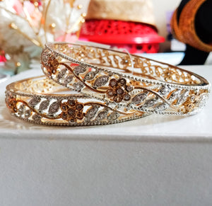 B063_Gorgeous gold plated bangles  studded with  American Diamond  stones.