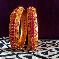 B034_Gorgeous Gold plated bangles matte finish studded with pink ruby stones.