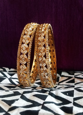 B066_Gorgeous Gold plated bangles  studded with  American Diamond  stones.