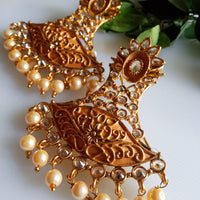 E0835_Gorgeous Golden Meenakari style earrings studded with stones with a touch of pearls.