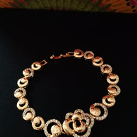 B0203_Elegant golden color bracelet studded with dazzling american diamond stones with delicate craft work.