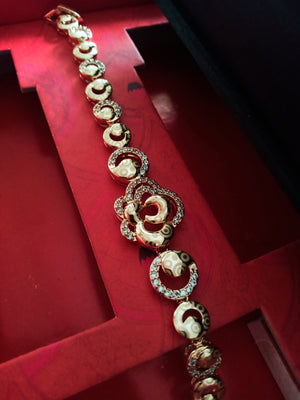 B0203_Elegant golden color bracelet studded with dazzling american diamond stones with delicate craft work.