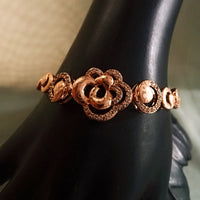 B0203_Elegant golden color bracelet studded with dazzling american diamond stones with delicate craft work.