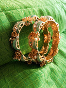 B0220_Gorgeous bangles with vibrant Meena work with a touch of semi precious stones and bead drops.