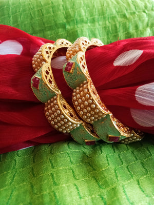 B0219_Gorgeous bangles with vibrant Meena work with a touch of semi precious stones with delicate craft work.