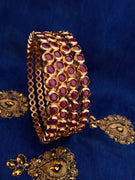 B0154_Elegant pink ruby studded bangles with fine stone work.