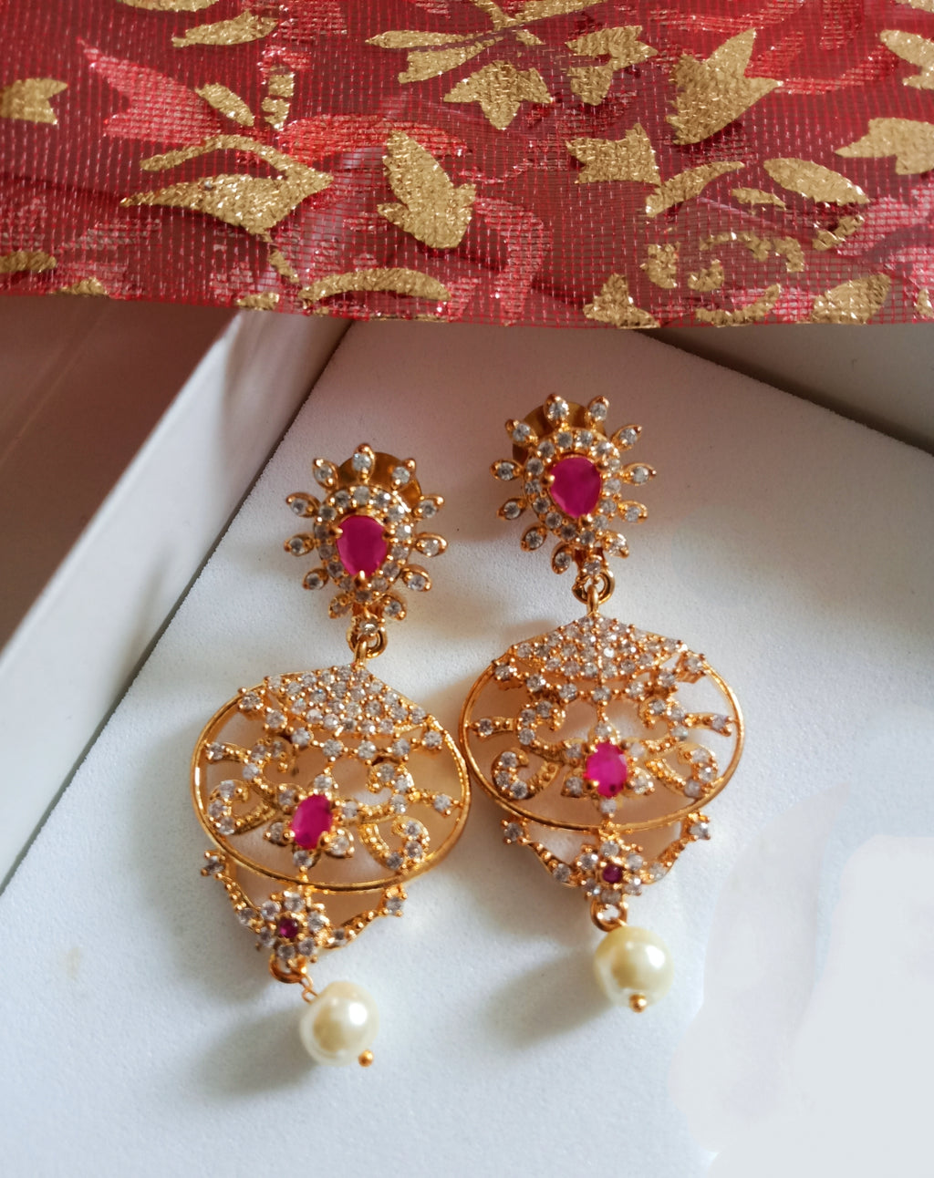 E0640_Gorgeous crafted danglers with a touch of American Diamond stones & pearl drops.