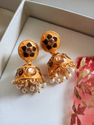 E0648_Beautiful crafted jumkas studded with stones with a touch of pearl drops.