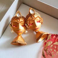E0635_Beautiful crafted women face embossed earrings with a touch of stones.